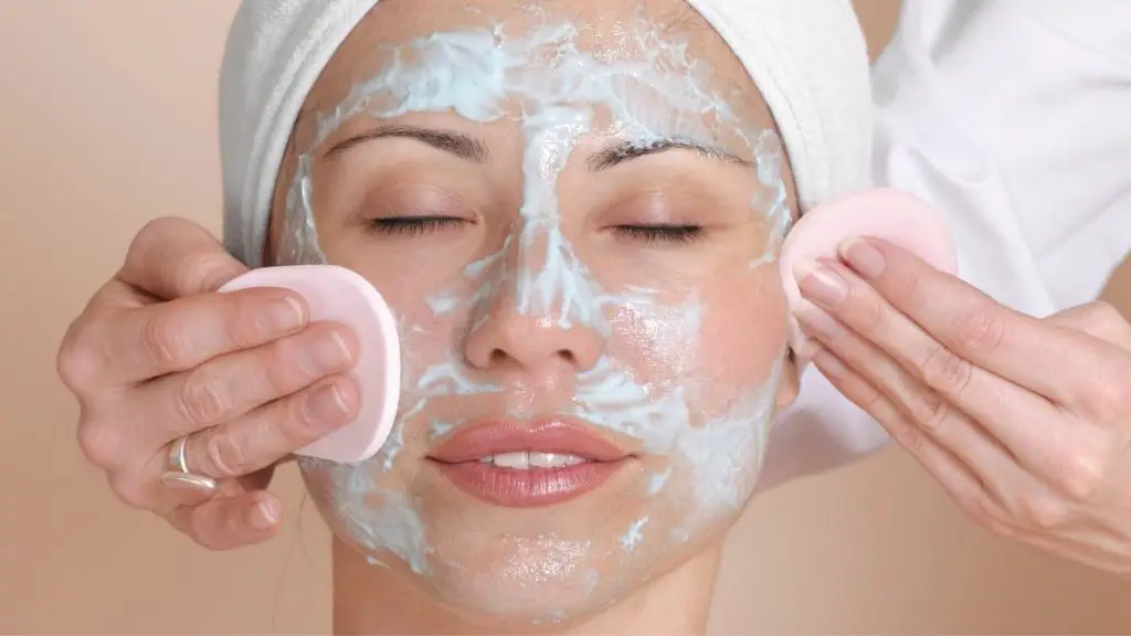 women scrubbing her face