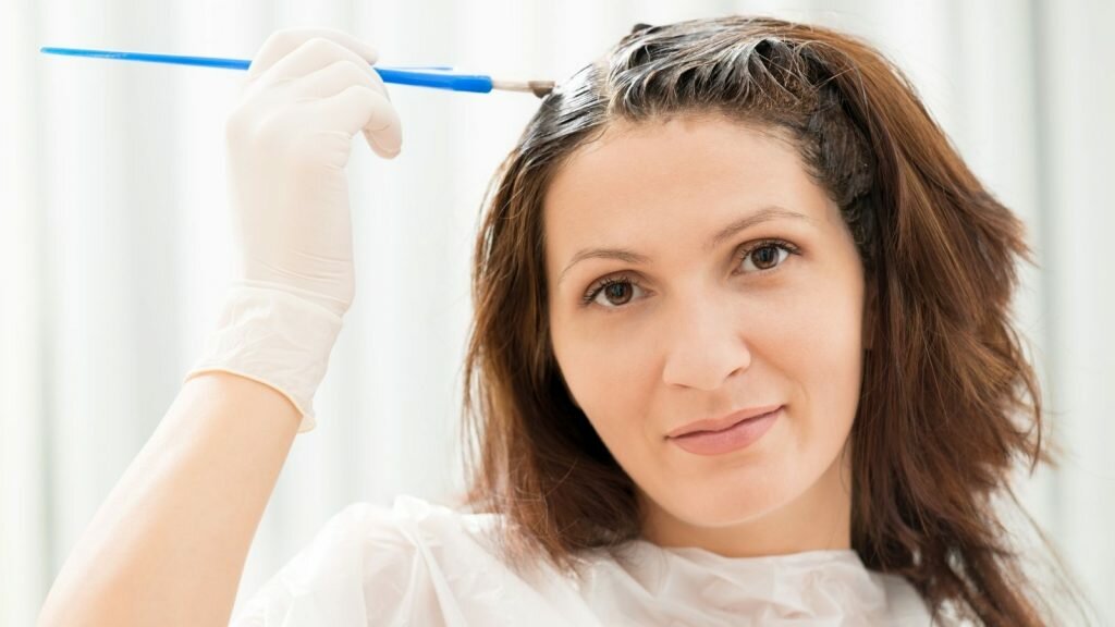 Woman bleaching her hair