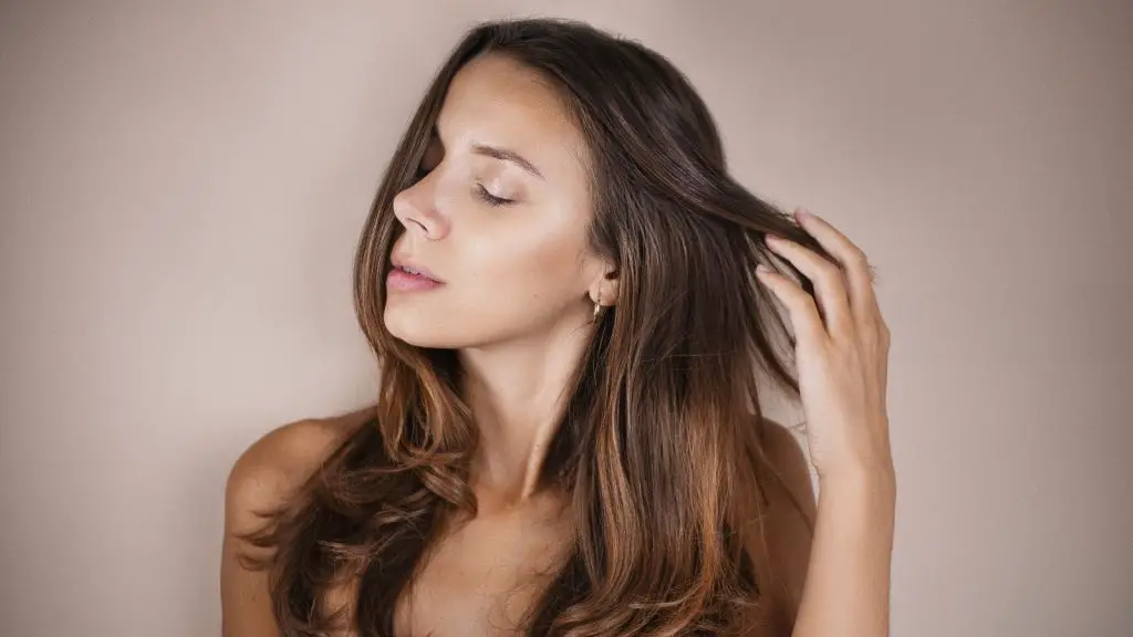 woman stroking her beautiful hair