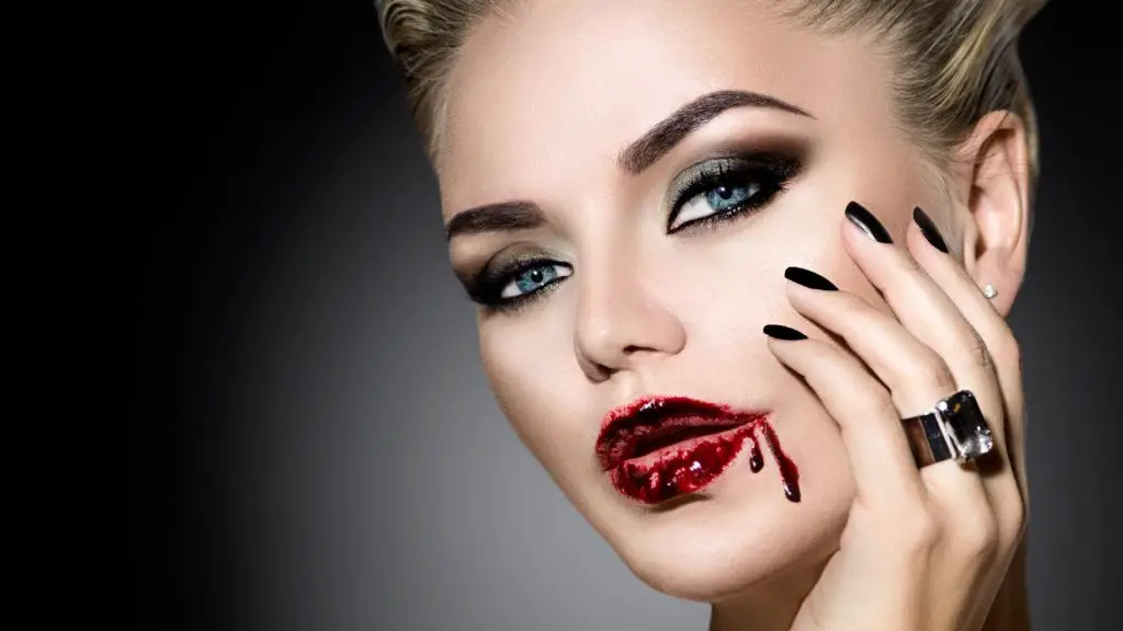 red lipstick and black nail polish