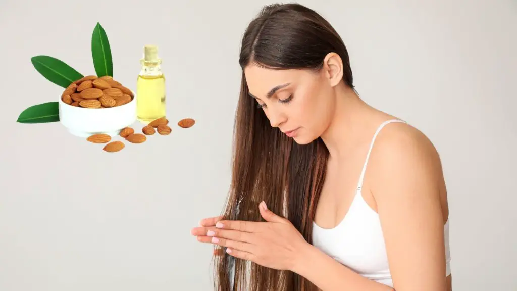 Woman applying almond oil on her hair
