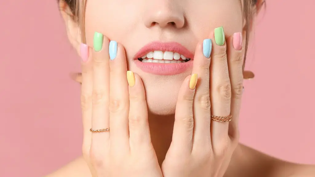 a girl with her hand on different types of gel nails