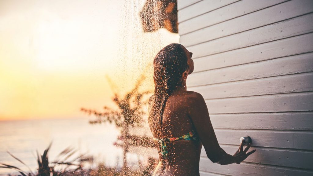 showering-after-tanning-on-beach-1024x576-2059867