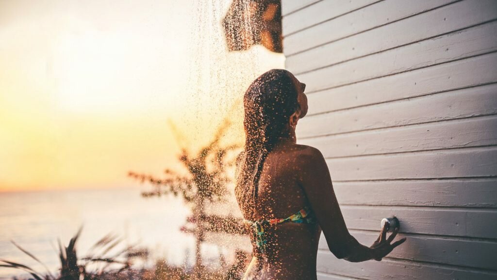 Showering after tanning on beach