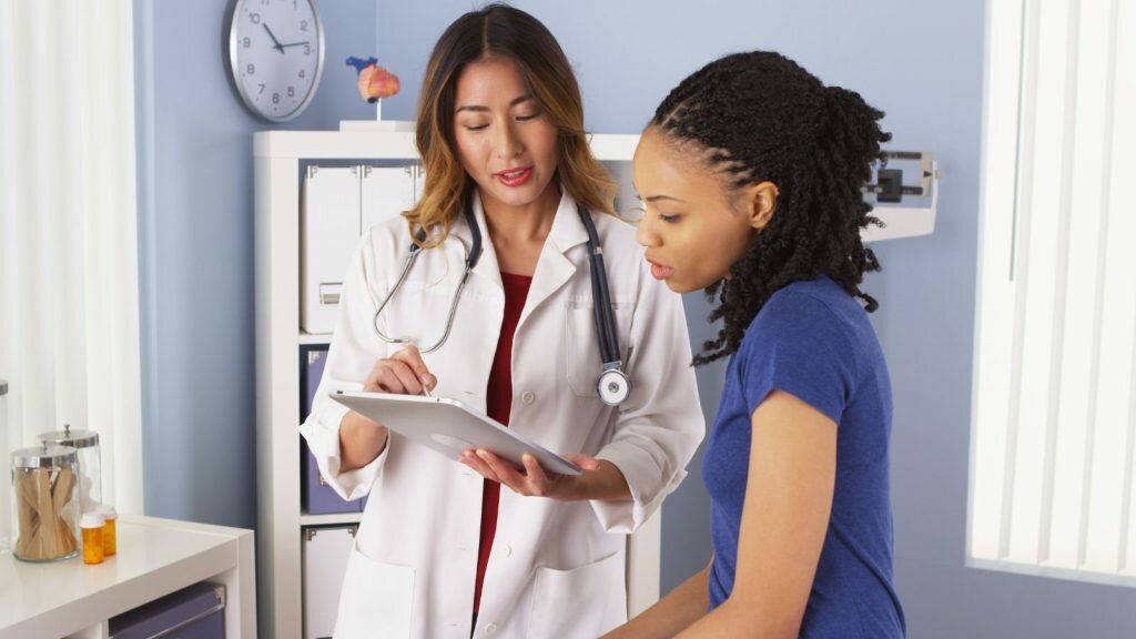 women talking with doctor