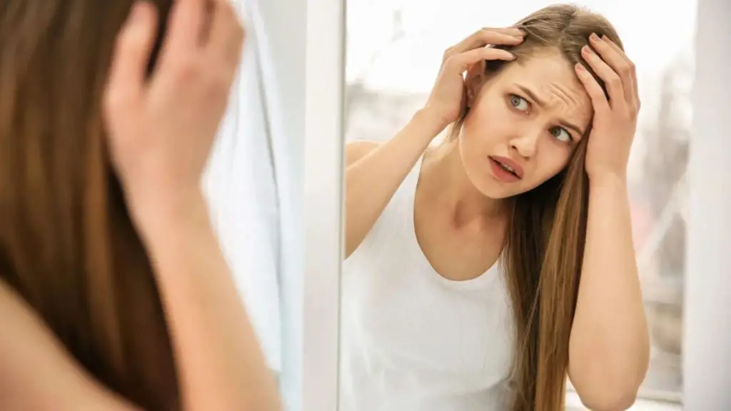 women check her hair scalp
