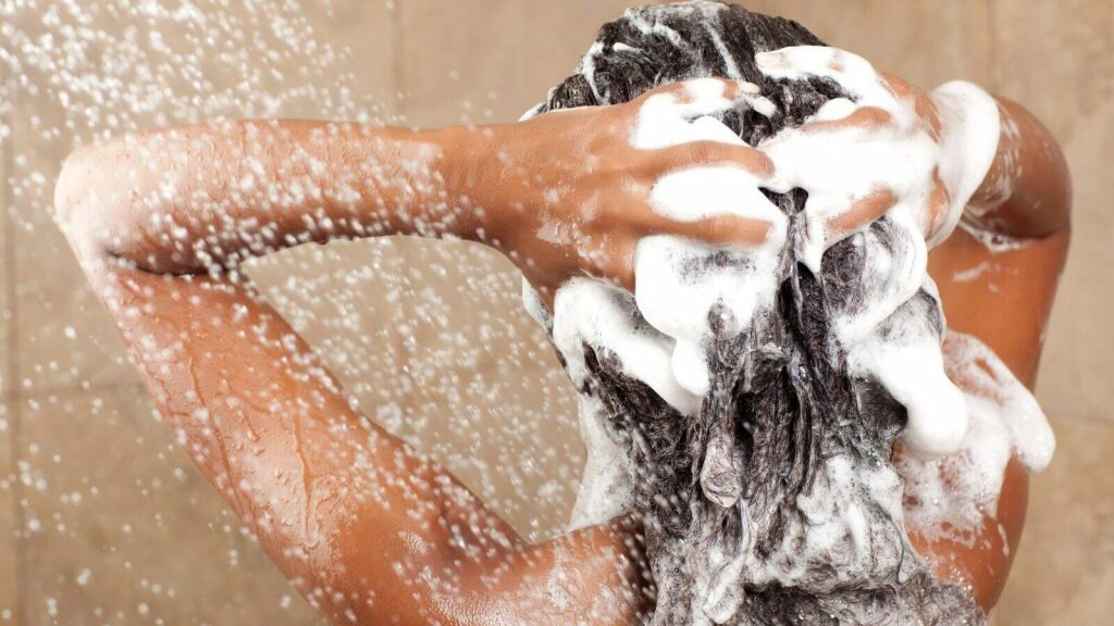 women washing her Deep Wave Hair and body